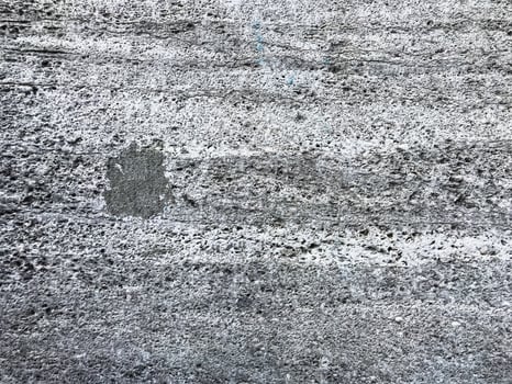 Grey and white wall with a small hole in it photo