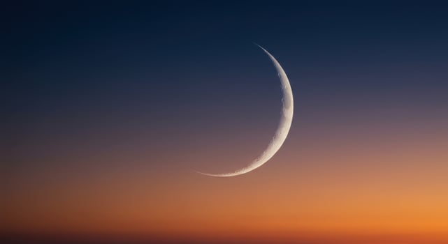 Crescent Moon at Sunset Peaceful Night Sky Celestial Scene Orange Hues dark space light lunar image photo