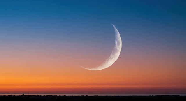 Crescent Moon over Serene Sunset Landscape Peaceful Night Sky dark calm ocean nature scenic colors photo
