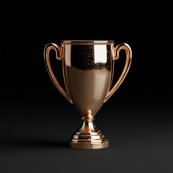 Golden trophy on black background photo