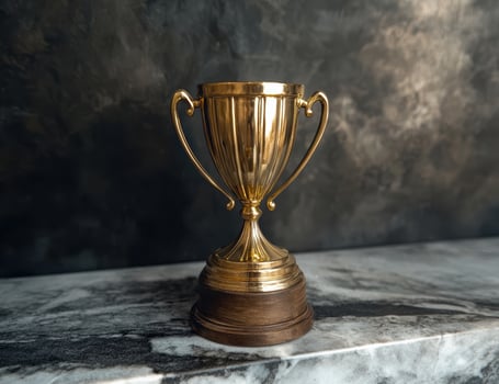Golden trophy on marble surface photo