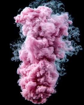 Abstract pink and white ink swirling inside water. photo