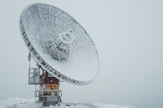 Large satellite dish covered with frost during winter photo