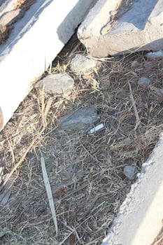 A broken down fire hydrant laying on the ground photo