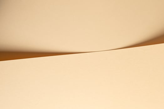 A beige cream paper background with a neutral and refined texture, exuding a timeless and photo