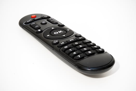 Remote control on a white background for home entertainment needs photo