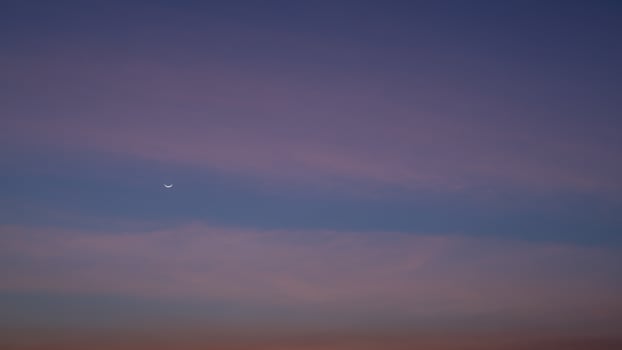 Evening sky, Beautiful clouds at dusk over the city, Moon and star, Nature background, Beautiful dark sky and bright white stars, Colorful clouds in summer, Peaceful and beautiful sunset. photo