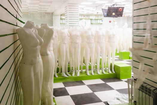 clothing store with full body dress mannequins photo