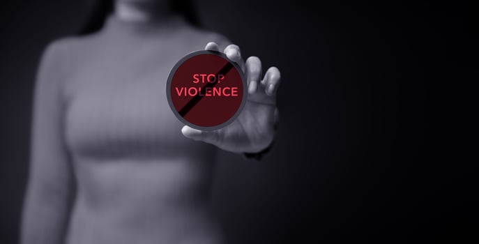 Protest and Expression Concept. Young Women Raised a Word of Stop Violence. Front View and Dark Dramatic tone photo