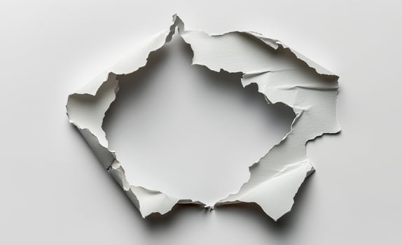 Torn paper revealing blank space, ideal for creative backgrounds and design projects photo