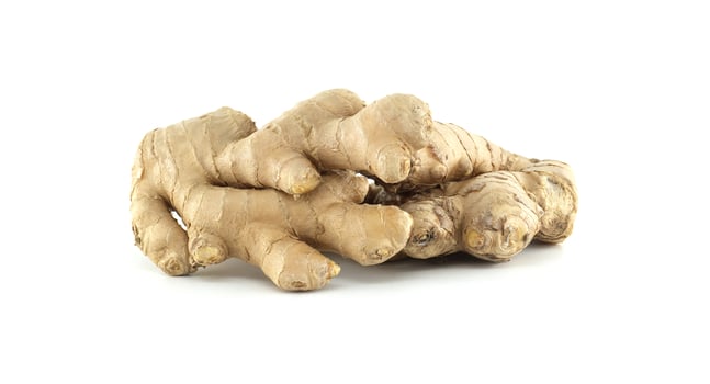Fresh ginger root Zingiber officinale lying on white background photo