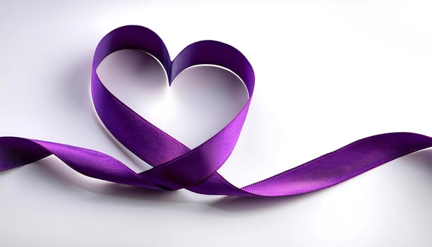 Purple ribbon in the shape of a heart on a white background, world cancer day photo