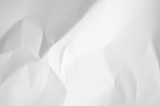 a white piece of paper with crumpled edges. photo