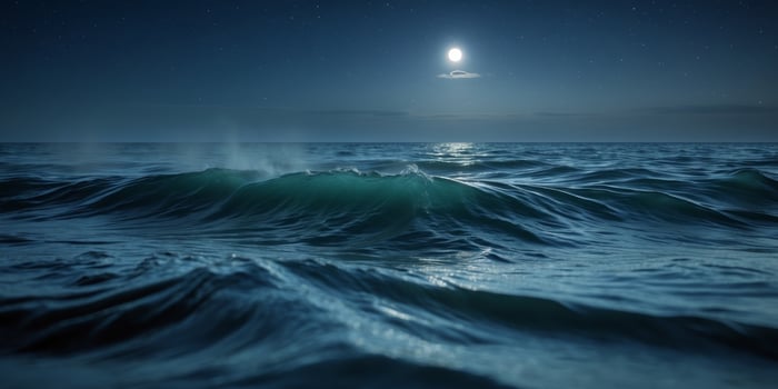 Dark blue ocean waves at night with a deep and serene atmosphere. photo