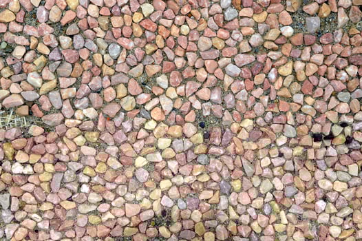 Background made of beige,brown and dark brown small stones photo