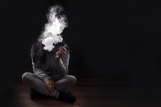 girl smoking a vape photo