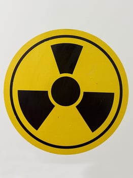 Yellow and Black Radiation Hazard Symbol on White Background photo