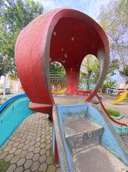 Colorful Playground Slide with Stone Steps Attached photo