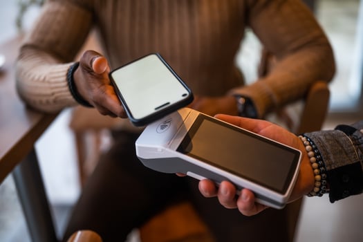 Close up of payment with smartphone photo