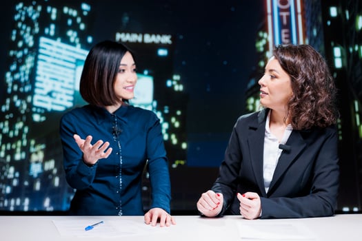 Presenters team host night talk show in newsroom, reporting important topics information with exclusive details. Diverse journalists reporting celebrity drama and creating tv content. photo