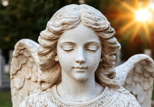 Serene angel statue with closed eyes photo