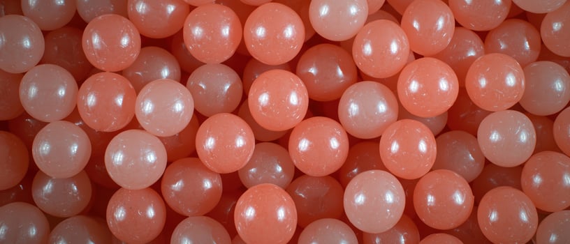 Coral colored plastic balls background photo
