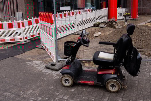 Scooter parked near construction site in urban area photo