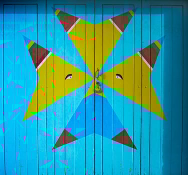 Colorful Geometric Street Art Wooden Door Blue and Yellow Abstract Design in Marsaxlokk, Malta photo