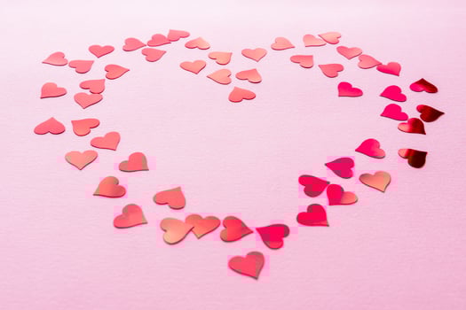 Stylish red hearts confetti frame on pink background with copy space. Happy valentines day. Love banner photo