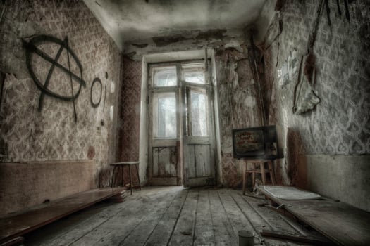 Creepy broken television in dirty room photo