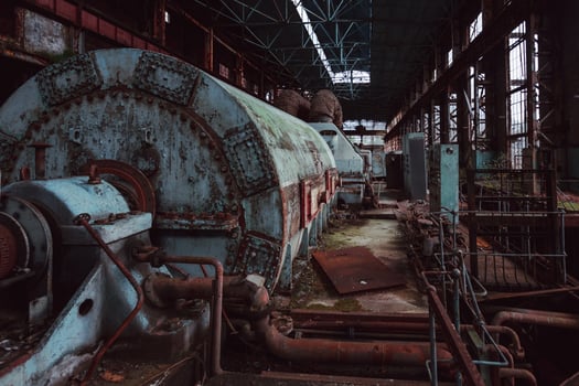 Abandoned destroyed by war and overgrown by plants and moss machinery of Tkvarcheli Tquarchal power plant, Abkhazia photo