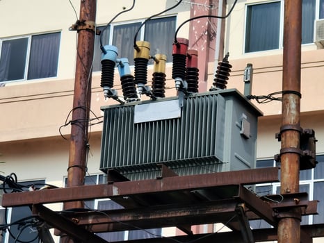 Electric transformer installed on the electric pole tower. photo