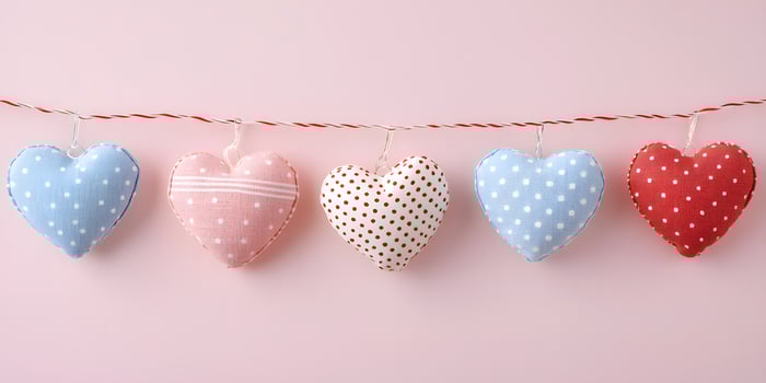 Colorful Valentine Day heart decorations on string. . photo