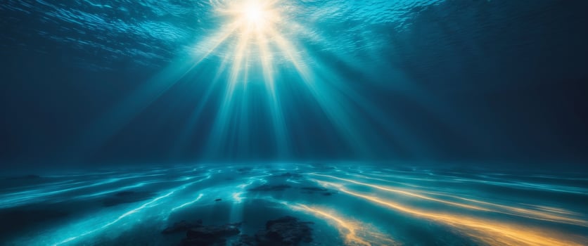 Underwater Scene With Bright Sunlight Rays and Dark Blue Water. photo