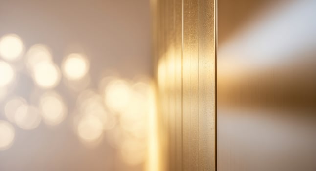 Sleek gold panel wall with smooth transitions and warm lighting effects photo