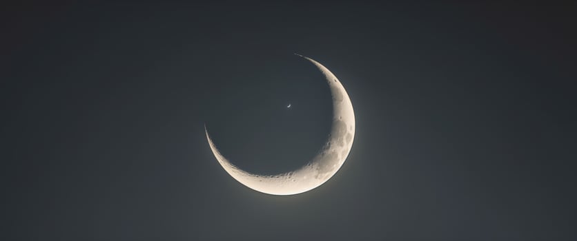 Radiant Crescent Moon on Dark Background. photo