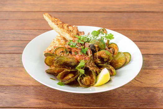A plate of food on a wooden table photo