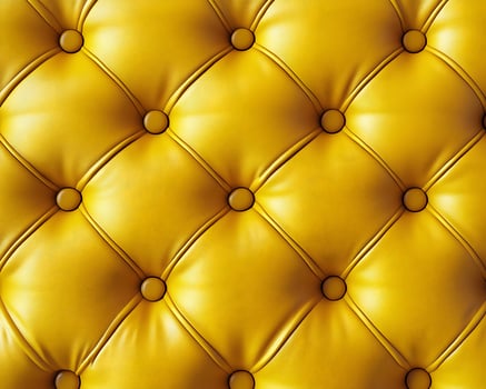 Yellow Tufted Leather Upholstery Texture Background photo