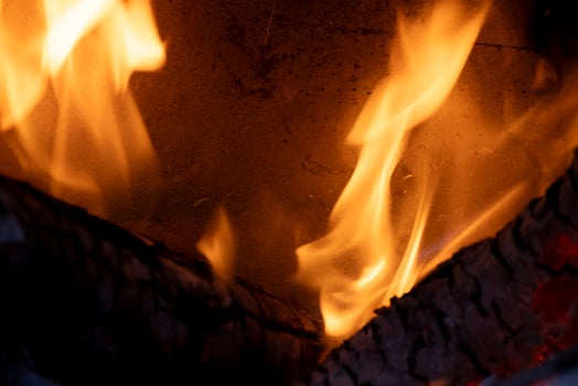 A burning flame with charcoals in the stove photo