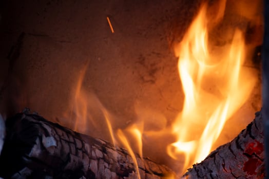 A burning flame with charcoals in the stove photo