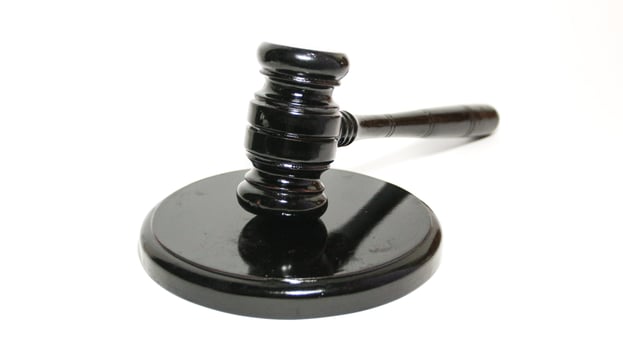 Gavel and legal wooden hammer the symbol of law photo