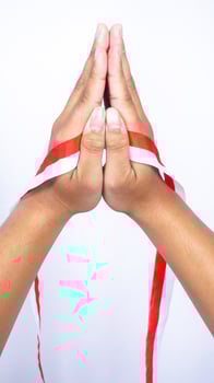 Hands with Red and White Ribbons on White Background photo