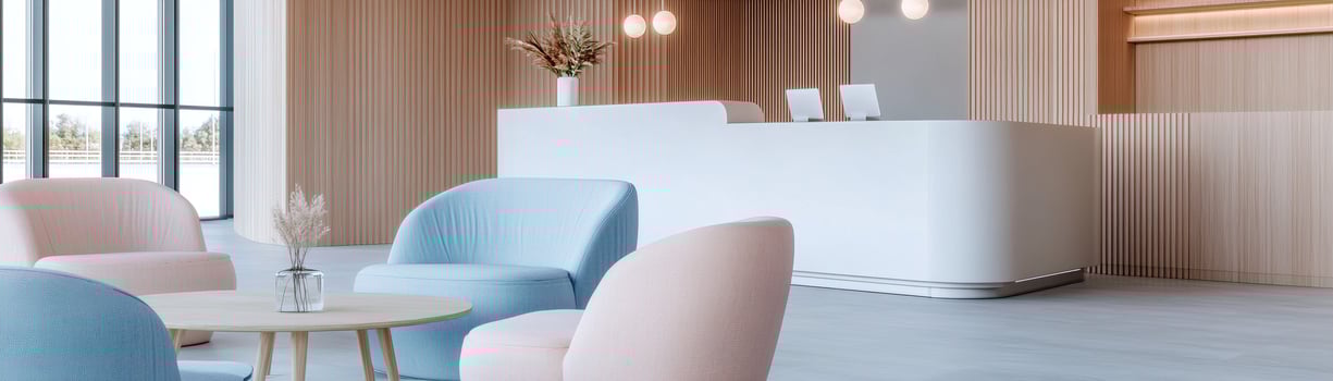 The reception area features a smooth white desk against a backdrop of wood paneling. Cozy pastel seating invites relaxation, complementing the soft ambient lighting for a serene workspace photo