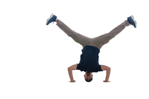 A Dynamic Handstand Move Performed by a Young Man, Showcasing Incredible Skill and Balance photo