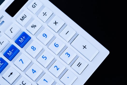Calculator on black background photo