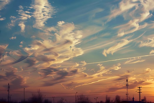 A sunset with clouds in the sky photo