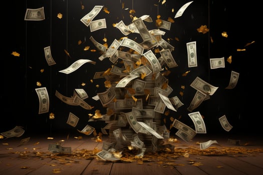 Money and golden leaves falling on a wooden surface creating a pile of cash photo