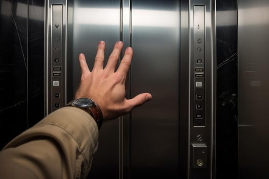 Businessman waiting for elevator in modern building photo