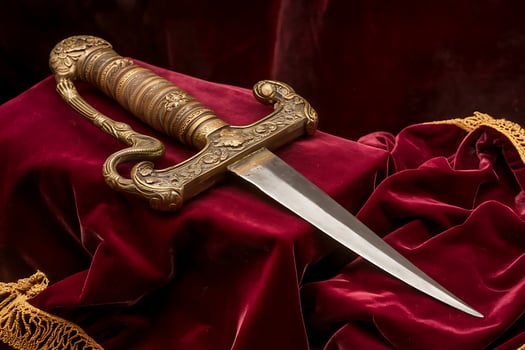 A knife on a red cloth photo
