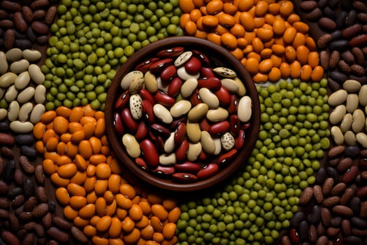 Wooden bowl with kidney beans surrounded by colorful legumes forming a circle on table photo